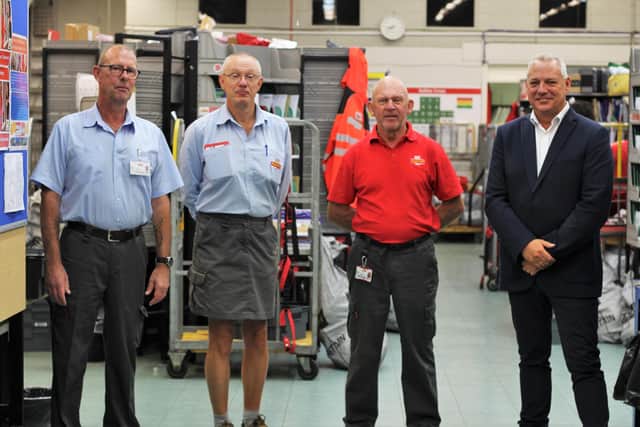 Iain Barker with his Royal Mail colleagues who are joining him on the charity hike in aid of the NHS
