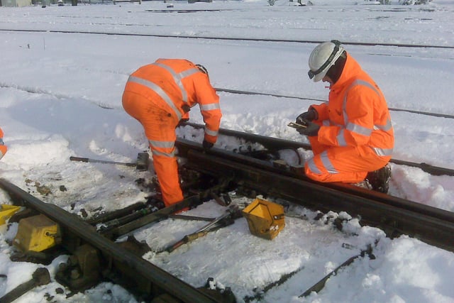 The snow is proved a challenge for the rail network in South Yorkshire - here workmen carry out essential work on a set of points at Doncaster in December 2010
