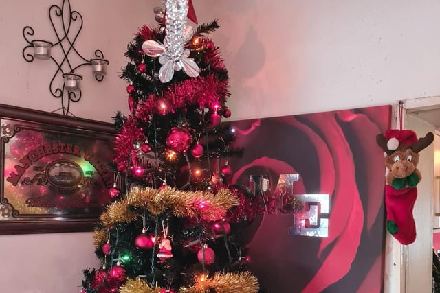 Hot pink decorations light up Michelle Albans' Christmas tree