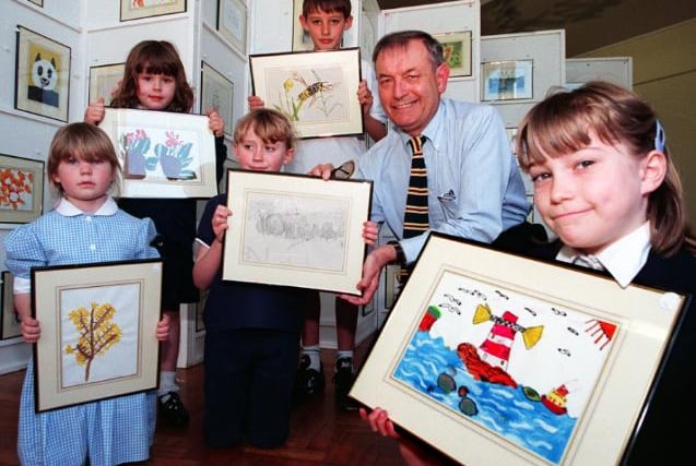 Barnburgh School had an art exhibition in 1997. Chairman of the Governers David Hughs here with children.