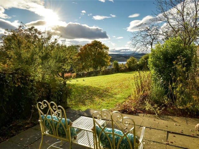 Seating area with view of loch.