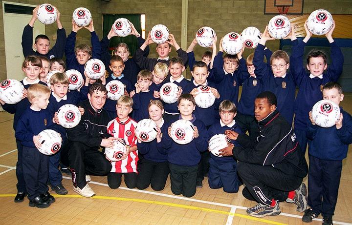 Some of the pupils of Intake School who took part in a penalty shoot-out in aid of charity. Also pictured are Matt Davis and Ashley Roberts, members of the Sheffield United Soccer in the Community project, on February 4, 2000