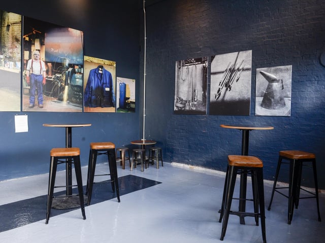 Pictures inside the bar reflect on the building's industrial past.