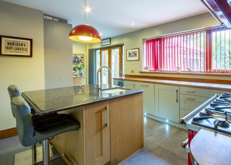 Another view of the spacious kitchen, fitted with all the mod-cons you need. Breakfast on the island, anyone?