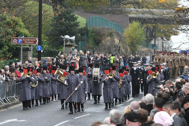 The Royal Signals Northern Band and the Bearpark and Esh Colliery Band leading the parade along Burdon Road.