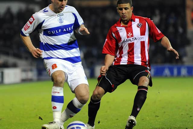 Queens Park Rangers' Rowan Vine is challenged by Sheffield United's Kyle Walker: PA Wire