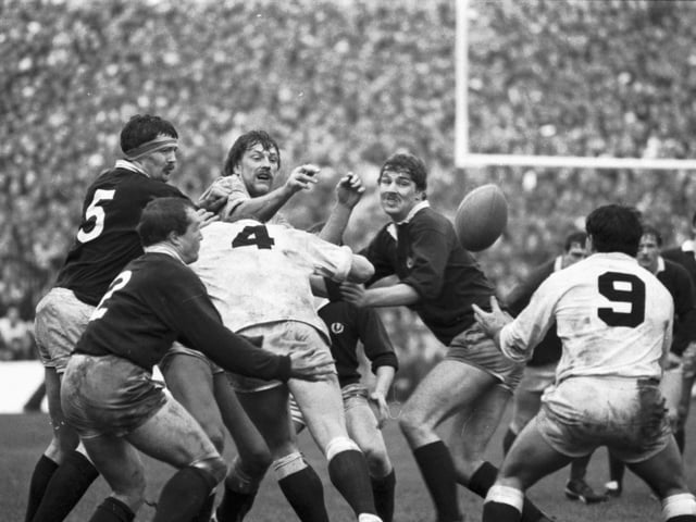 England's Steve Bainbridge gets the ball away during the Scotland v England Five Nations rugby match at Murrayfield in February 1984. After beating England to take the Calcutta Cup and beating Wales to win the Triple Crown, Scotland completed the Grand Slam by beating France 21-12.