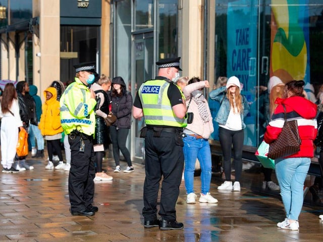 Police officers patrolled outside the Primark store in Edinburgh as shoppers queued to go inside