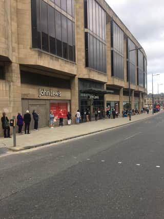 Shoppers queued up as they waited on John Lewis to open this morning