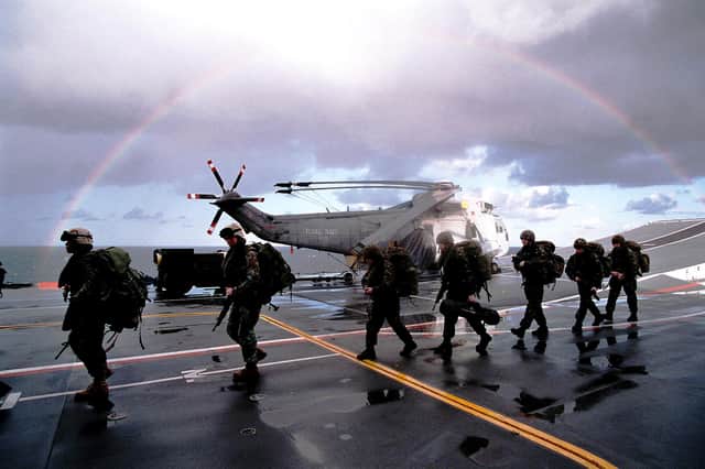 Members of close combat troop from Delta Company 40 Commando Royal  Marines preparing to board CH 47 Chinook aboard HMS Ark Royal during NTG 03.Picture: LA (PHOT) SEAN CLEE COMATG (PHOT)