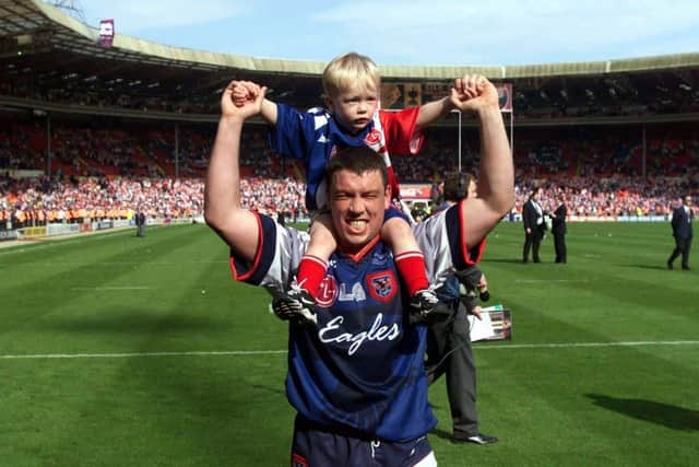 Mark Aston post-Challenge Cup final, with son Cory on his shoulders. Cory now plays for the Eagles, in the same position as his father.