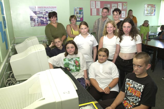 Newfield Summer Literacy school pupils invited parents to see their work  done during the school. Seen are some of the pupils with parents who set up their own web site back in 2000