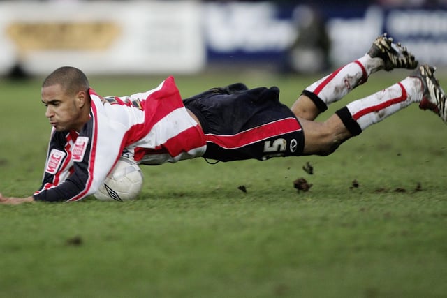David McGoldrick of Southampton is tackled during the FA Cup match  between Torquay United and Southampton