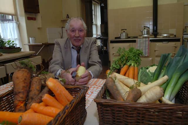 Class divide: former kitchen boy Arthur Allen peeling spuds in the Aga kitchen and scullery at the seriously posh Brodsworth Hall in Doncaster in 2008