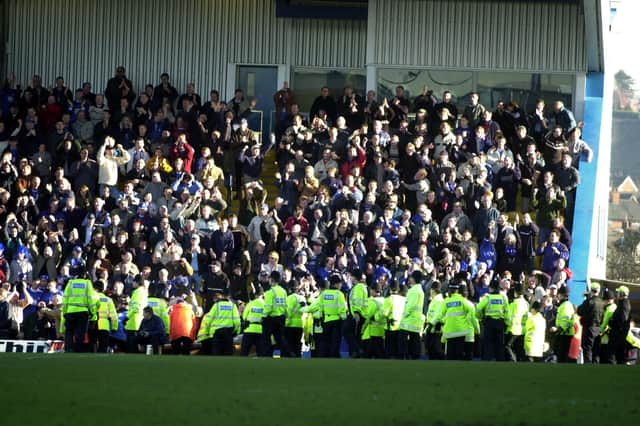 Police keep their eye on Chesterfield's fans in their 1-0 win in Febraury 2001.