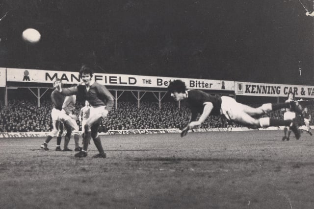 A dlying header from Chesterfield FC's record goalscorer Ernie Moss. The Recreation ground looks packed and the picture is dated 15 December 1971