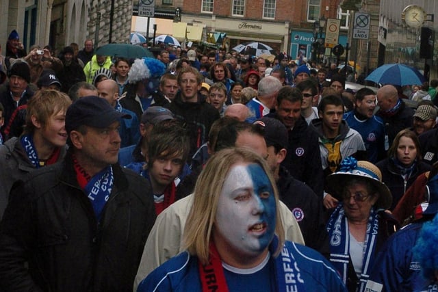 Chesterfield fans parade through the streets before the game.