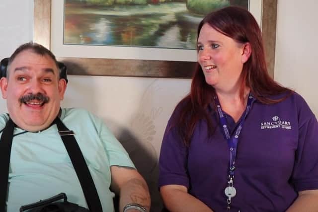 Resident Ian Troops with Wellbeing and inclusion assistant Helen Flowers.