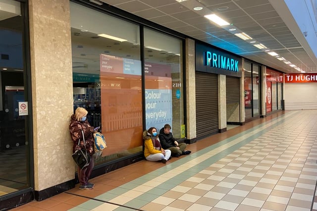 People waiting outside Primark in Middleton Grange Shopping Centre