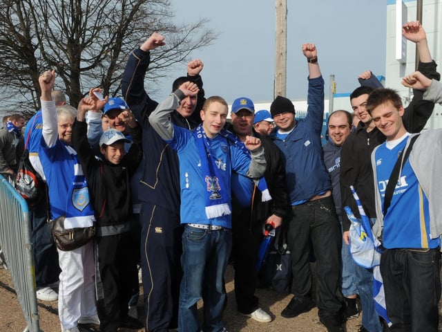 Fans get ready to board their buses for Wembley at Fratton Park.