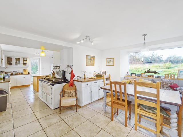 The large dining kitchen boasts views across the picturesque island scenery