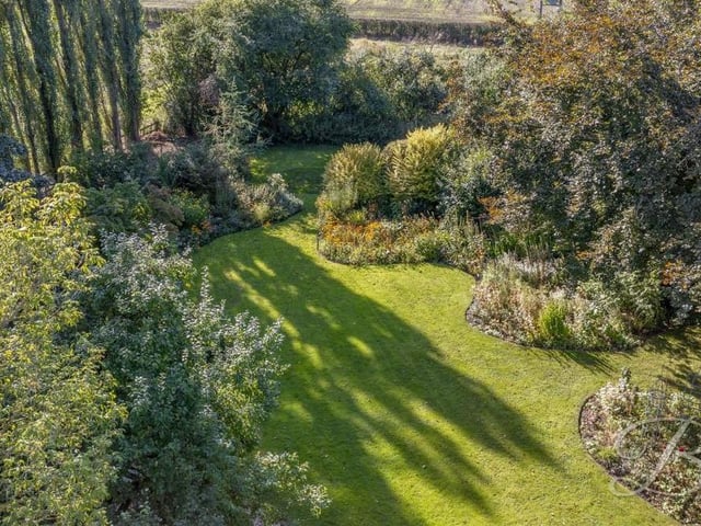 This photo gives you an idea of the glorious, well-maintained garden at the back of the house. It looks great all year round.