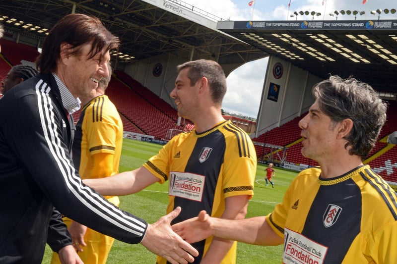 Manager Sean Bean meets the players before the kick-off of a charity match between Sheffield United Legends and Fulham All-Stars at Bramall Lane in May 2016 - his team won