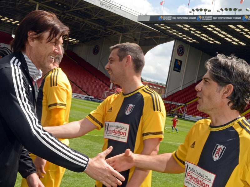 Manager Sean Bean meets the players before the kick-off of a charity match between Sheffield United Legends and Fulham All-Stars at Bramall Lane in May 2016 - his team won