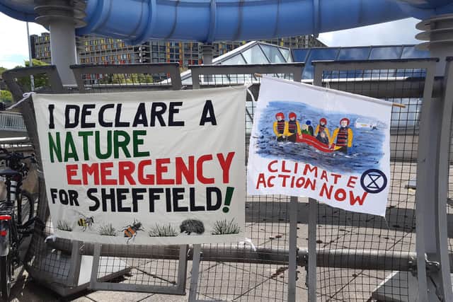 An image of banners outside a Sheffield City Council meeting held at Ponds Forge during the pandemic, when it was agreed to declare a nature emergency in the city