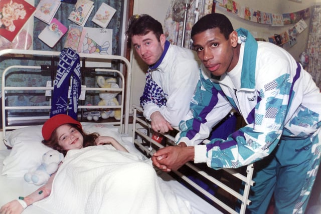 John Sheridan and Carlton Palmer are pictured with 11-year-old Lisa Flinders, of Hillsborough, at Sheffield Children's Hospital in December 1995.