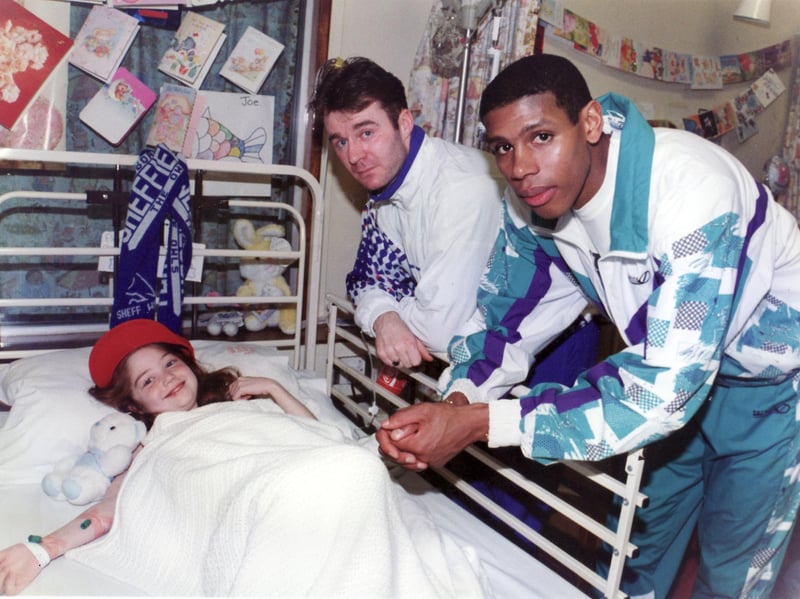 John Sheridan and Carlton Palmer are pictured with 11-year-old Lisa Flinders, of Hillsborough, at Sheffield Children's Hospital in December 1995.