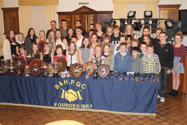 Members receive medals and trophies at Buxton Swimming Club's annual presentation evening at Buxton and High Peak Golf Club in 2013.
