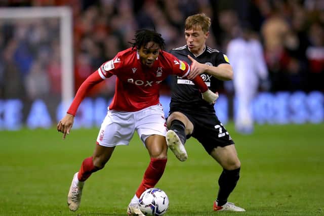Nottingham Forest's Djed Spence (left) and Sheffield United's Ben Osborn battle for the ball during the Sky Bet Championship match at City Ground, Nottingham. Picture date: Tuesday November 2, 2021. PA Photo. See PA story SOCCER Forest. Photo: Simon Marper/PA Wire.