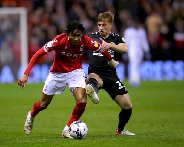 Nottingham Forest's Djed Spence (left) and Sheffield United's Ben Osborn battle for the ball during the Sky Bet Championship match at City Ground, Nottingham. Picture date: Tuesday November 2, 2021. PA Photo. See PA story SOCCER Forest. Photo: Simon Marper/PA Wire.