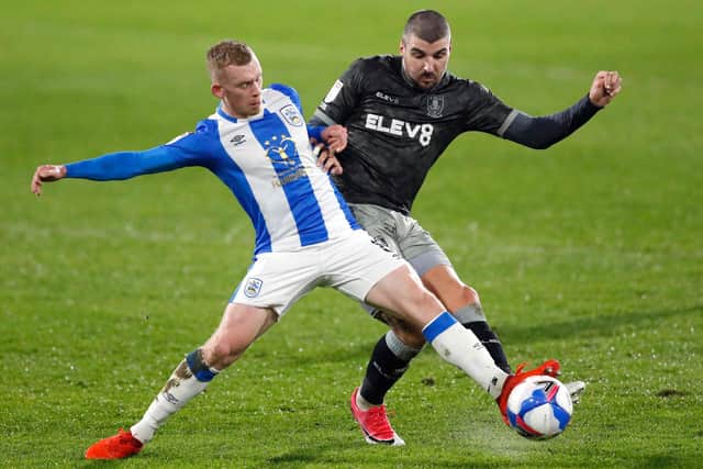 Callum Paterson loses out to Huddersfield's Lewis O'Brien in Sheffield Wednesday's lacklustre 2-0 defeat at Huddersfield.