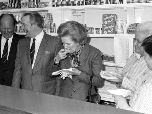 Prime Minister Margaret Thatcher eats a doughnut at Houston's bakers during a visit to Hawick in September 1986.