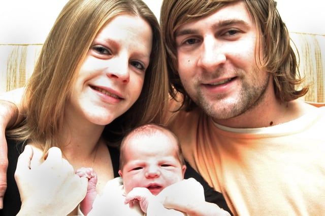 Nicola Coope and Chris Redfern with their baby daughter, Sophie, at home in Ripley in 2007.