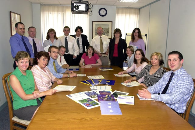 Beta Technology Managing Director Rachel Fletcher (back row, second right) and Chairman Dr Bob Keown OBE (back row, third  right) are pictured with staff members at the company's Barclay Court, Doncaster Carr, Doncaster offices in 2002