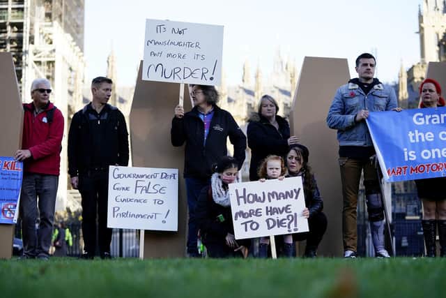 Demonstrators protesting against smart motorways march with coffins across Westminster Bridge to Parliament Square in London. Picture date: Monday November 1, 2021. PA Photo. See PA story TRANSPORT Smart. Photo credit should read: Aaron Chown/PA Wire
