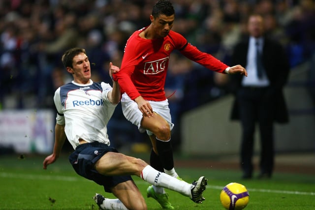 Chris Basham of Bolton goes in heavy on Cristiano Ronaldo of Manchester United during the Barclays Premier League match at the Reebok stadium on January 17, 2009  (Photo by Alex Livesey/Getty Images)