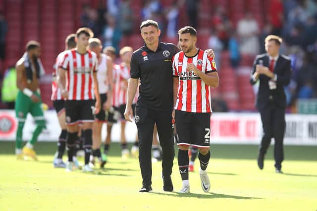SHEFFIELD, ENGLAND - AUGUST 20: Paul Heckingbottom, Manager of Sheffield United celebrates with George Baldock of Sheffield United after victory in the Sky Bet Championship between Sheffield United and Blackburn Rovers at Bramall Lane on August 20, 2022 in Sheffield, England. (Photo by George Wood/Getty Images)