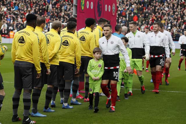 Pre-match handshakes were abandoned ahead of Sheffield United's game against Norwich City, their last Premier League match before lockdown: Simon Bellis/Sportimage