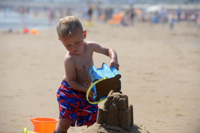 Youngster Grayson Cook, two, makes a sandcastle at Seaburn Beach.