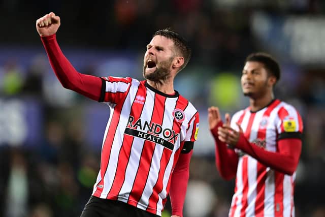 Oliver Norwood of Sheffield United celebrates the win at Swansea City thanks to Reda Khadra's late goal: Ashley Crowden / Sportimage
