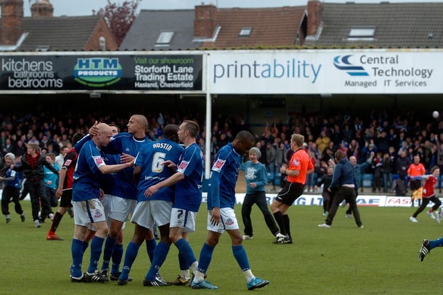 Spireites fans invade the pitch after Chesterfield score in the last minute against Bournemouth.