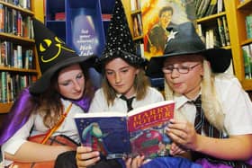 Harry Potter fans Holly White, Harriet McAra and Abigail Ives-Owen get in a little light reading before their sleep over at Woodseats library ready to read The Half-Blood Prince when it released at midnight. Dated July 16, 2005.