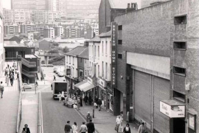 Rebels nightclub can be seen here on the far right, beide the goods entrance to British Home Stores on Dixon Lane in Sheffield city centre. This photo was taken in 1980