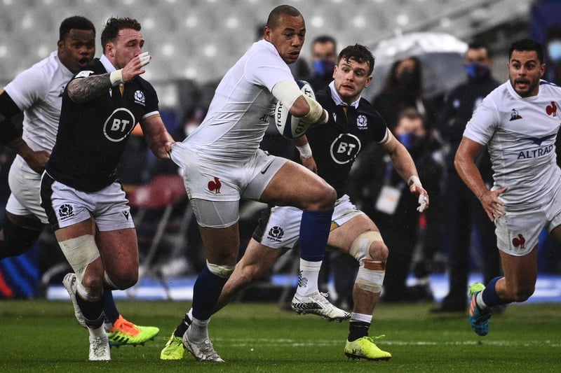 Gael Fickou trying to evade Scotland's Stuart Hogg and Darcy Graham at the Stade de France in Saint-Denis, outside Paris, tonight (Photo by Anne-Christine Poujoulat/AFP via Getty Images)