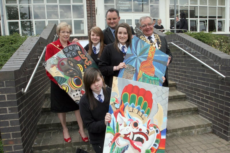 Parkside School pupils Charlotte Eyre, Hannah Barnett, Zoe Russell show their art to Chesterfield's mayor and mayoress, Keith and Pat Morgan, and headteacher Andrew Knowles in 2010.