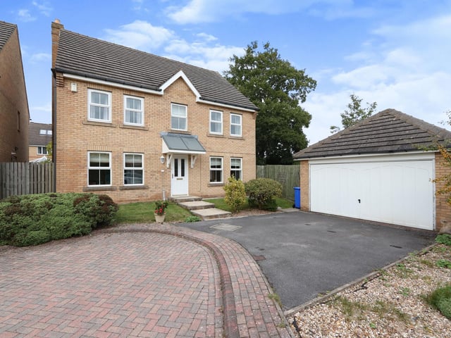 The front of the house, showing the double garage and the driveway